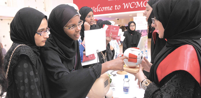 Students listen to a WCMC-Q representative at the fair. 