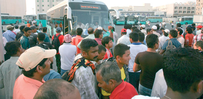 Passengers at the central bus station in Doha.