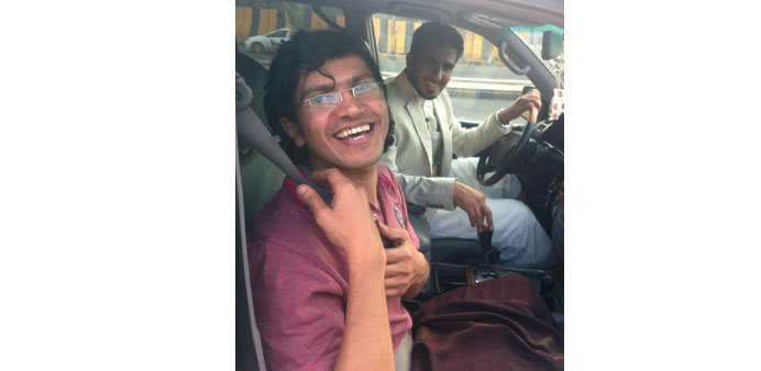  Shae smiles as he sits in a car following his release in Sanaa yesterday.