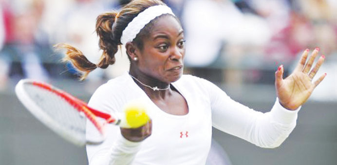Sloane Stephens returns a ball to Russiau2019s Olga Puchkova during their singles in the first round of the Washington Open on Monday.