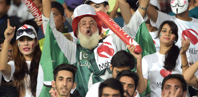 Fans cheer during the T20 match between Pakistan and Zimbabwe in Lahore. (AFP)