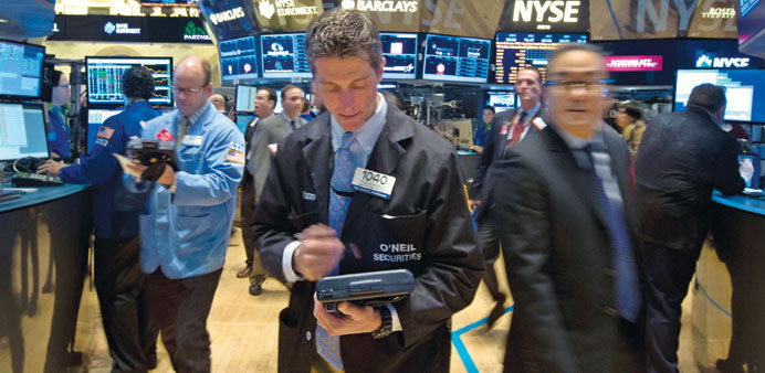 Traders work on the floor of the New York Stock Exchange. The Wall Street may kick off the second half of the year with an uptick in volatility.