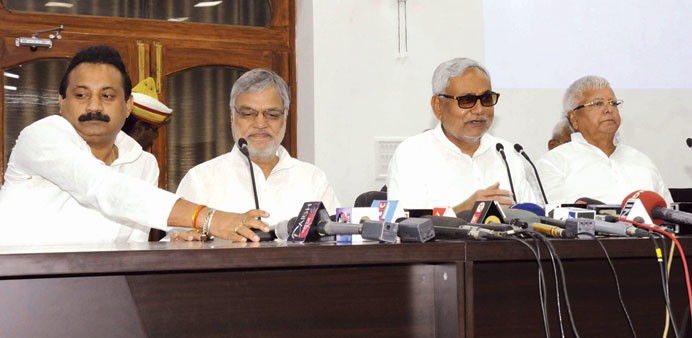 Bihar Chief Minister Nitish Kumar, RJD chief Lalu Prasad Yadav and Congress leader C P Joshi address a press conference in Patna.