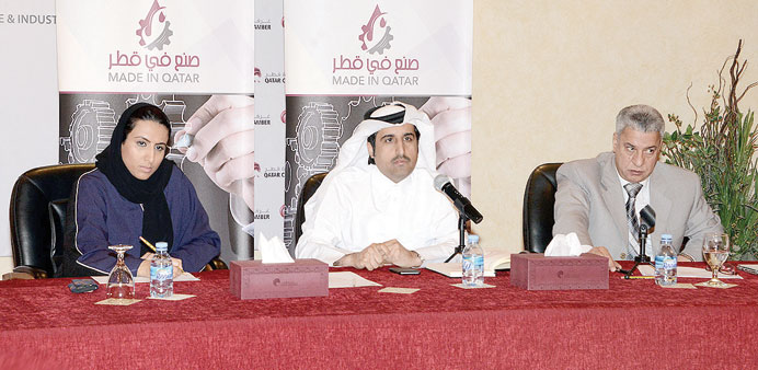 Al-Sharqi, flanked by Sheikha Noor and Rajab, at the productive families forum. 