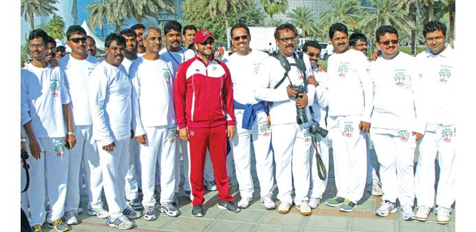 Galfar Al Misnad team members are seen with Sheikh Saoud bin Abdulrahman al-Thani at the u2018Go Greenu2019 Run.