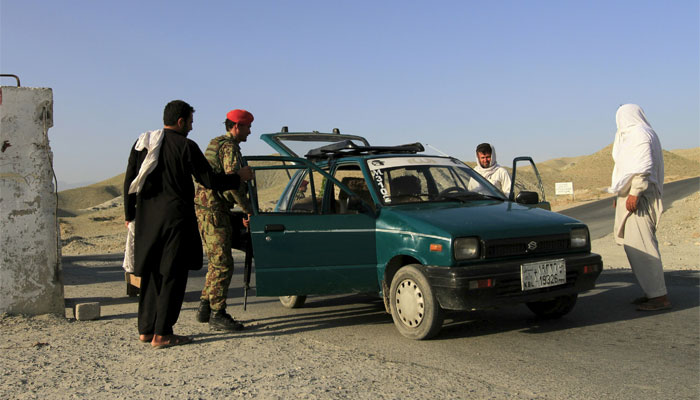 Afghan National Army (ANA) soldiers check a vehicle at a checkpoint on the outskirts of Jalalabad, June 29, 2015. Reuters 