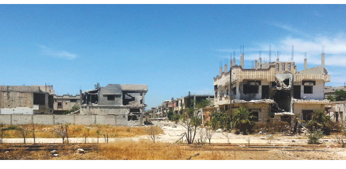 A picture taken on Thursday shows heavily damaged buildings in a neighbourhood in the eastern Syrian city of Qusayr.