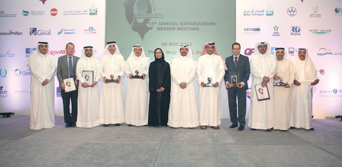 The participants of Qatarisation review meeting in energy sector.