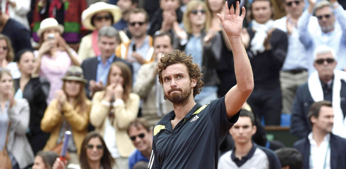 Latviau2019s Ernests Gulbis celebrates after his victory over Switzerlandu2019s Roger Federer at the French Open fourth round in Paris yesterday. (AFP)
