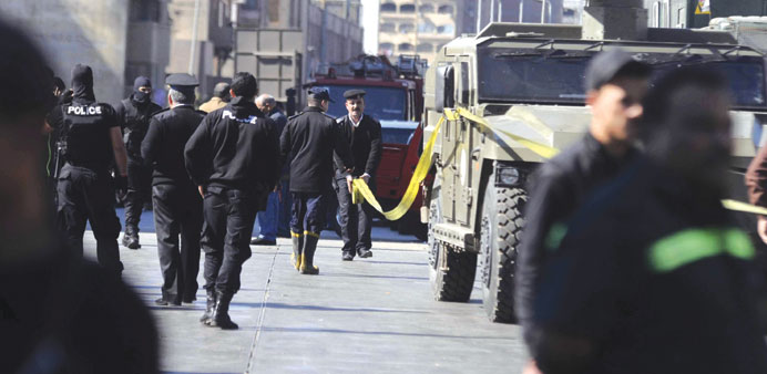Police cordon off the area that was targeted by two bombs in Cairo yesterday.