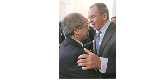 Russian Foreign Minister Sergei Lavrov welcomes Syrian Deputy Foreign Minister Faisal Mekdad during their meeting in Moscow yesterday.