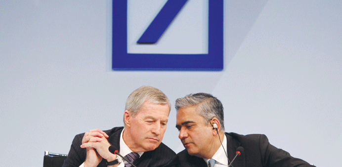 Anshu Jain, co-chief executive officer of Deutsche Bank (right) speaks to Juergen Fitschen, co-chief executive officer of Deutsche Bank