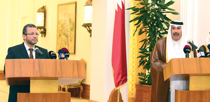 HE Sheikh Hamad bin Jassim bin Jabor al-Thani and  Hisham Kandil addressing a joint press conference in Doha yesterday