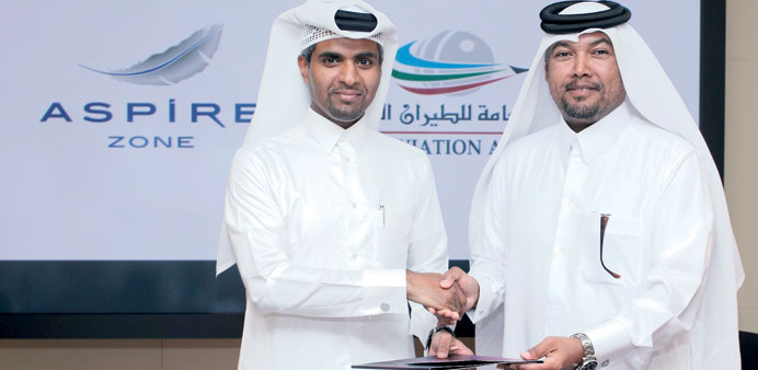 Representatives of AZF and QCAA at the signing ceremony.
