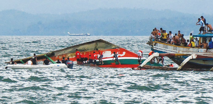 Rescuers search for survivors at the site off Ormoc City, central Philippines yesterday. 