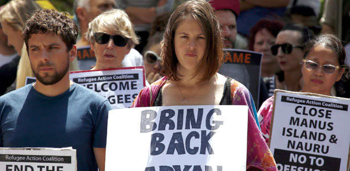 Protesters during a rally in support of refugees in Sydney yesterday.