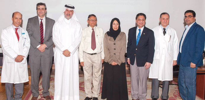 Dr Abdulla al-Ansari (third left) and Dr Hanan al-Kuwari (fifth left) with some of the speakers at the event.