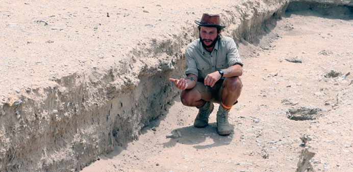 Spencer in Trench 53 at Wadi Debayan archaeological site. 
