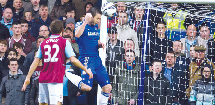 Chelseau2019s Frank Lampard (right) scores against West Ham during their Premier League match at Stamford Bridge yesterday. (EPA)