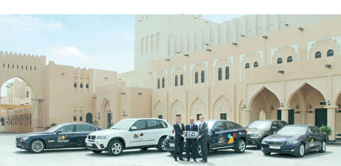 An array of BMW vehicles at a venue in Doha.