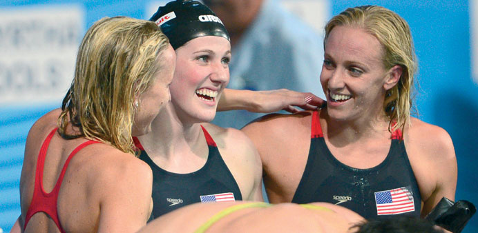 Jessica Hardy (left), Missy Franklin (centre) and Dana Vollmer (right) of the US celebrate their win in the 4x100m medley yesterday. (AFP)