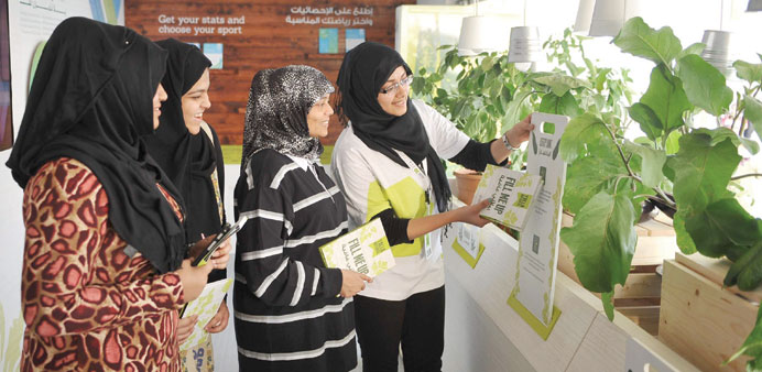 A volunteer explaining some interesting facts to visitors.