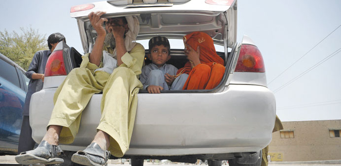 Pakistani civilians, fleeing from a military operation in North Waziristan tribal agency, arrive in Bannu district yesterday. 