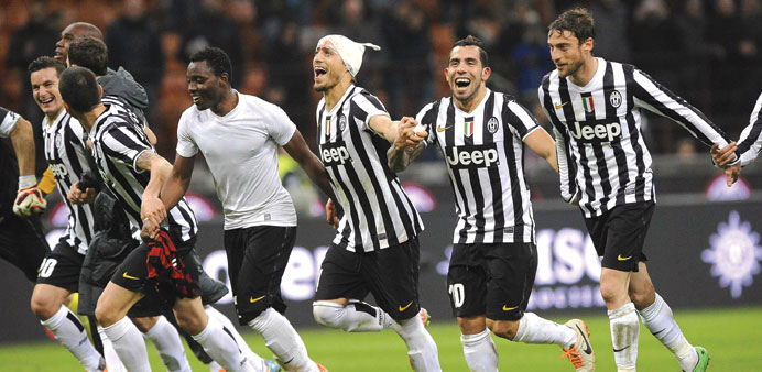 Juventusu2019 players celebrate at the end of their match against AC Milan at the San Siro stadium in Milan on Sunday. (Reuters)