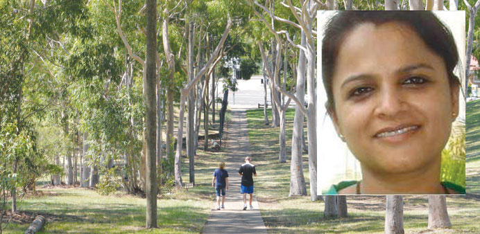 People walk in a Sydney park yesterday, past the spot where IT professional Prabha Arun Kumar (inset) was stabbed to death during a brutal attack.