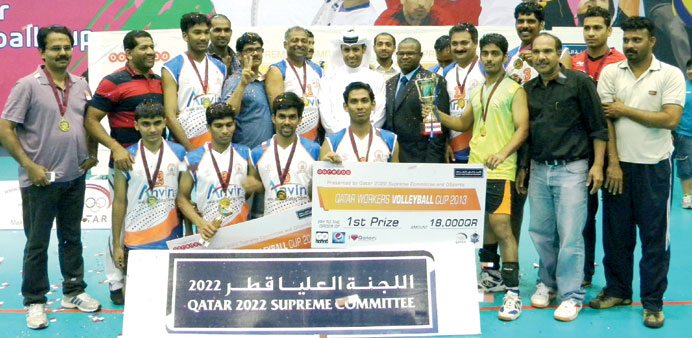 QSports chairman Ghanim al-Mohannadi and Ahmed Izeldin from Ooredoo join the champions.