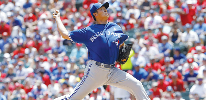Toronto Blue Jays pitcher Chien-Ming Wang throws against the Texas Rangers during the second inning of their MLB American League baseball game in Arli