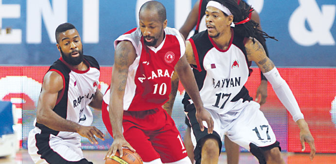 Al Rayyan and Al Arabi players in action during their HH Emir Cup basketball match yesterday. 