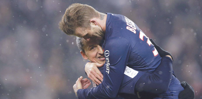 Paris Saint-Germainu2019s Beckham congratulates Ibrahimovic after his goal against Olympique Marseille in their French Ligue 1 match at Parc des Princes s
