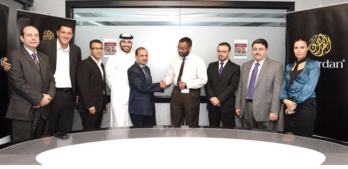 QRC and Alfardan Group officials at the donation ceremony.