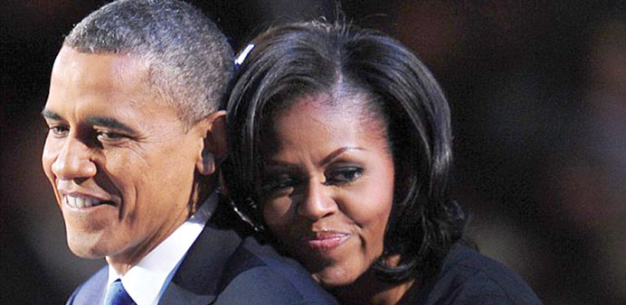NOT QUITE IN THE SHADOWS: Michelle with her husband President Barack Obama.