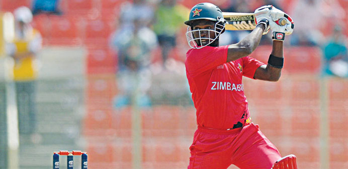 Zimbabweu2019s Elton Chigumbura slashes the ball over point during his 21-ball 53 against the UAE at the World T20 qualifers in Sylhet, yesterday. (ICC)