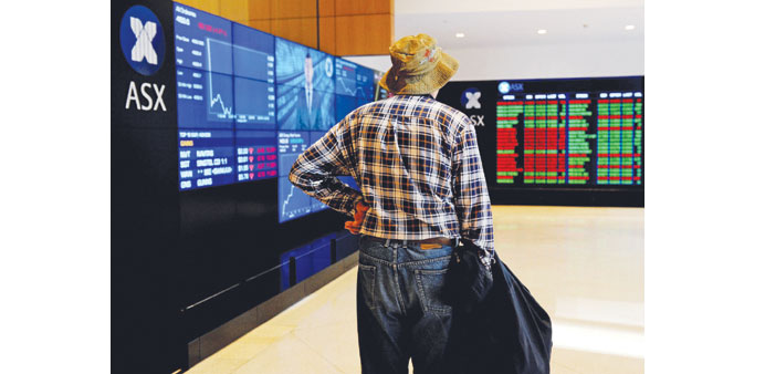 An elderly man watches the share prices at the Australian Stock Exchange. Sydney closed up 0.62% at 5,622.9 points yesterday.