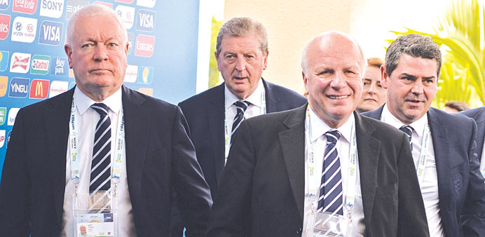 Englandu2019s coach Roy Hodgson (second from left) arrives for the World Cup draw with Football Association chairman Greg Dyke (second from right) yesterd