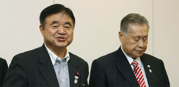 Toshiaki Endo (L), the new cabinet minister in charge of the Tokyo Olympics and Paralympics, and Yoshiro Mori (R), president of the Tokyo 2020 Olympic
