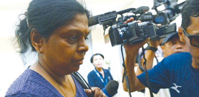 Raji Sukumaran (left) is surrounded by the media as she visits her son Myuran Sukumaran, one of the ringleaders of the so-called u201cBali Nineu201d drug traf