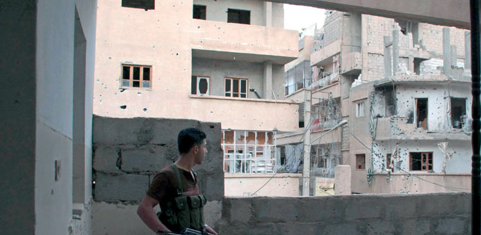 A Free Syrian Army fighter is seen in Deir al-Zor on Saturday.