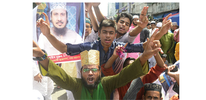 Activists of the Bangladeshi Islamic Chhatra Sena shout slogans during a strike demanding authorities arrest the killers of Sheikh Nurul Islam Faruqi,
