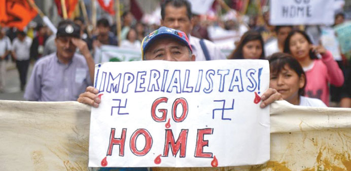 Demonstrators protest against the International Monetary Fund annual meetings taking place in Lima.
