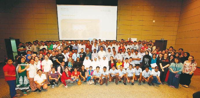 Officials with the students and workers who were felicitated recently