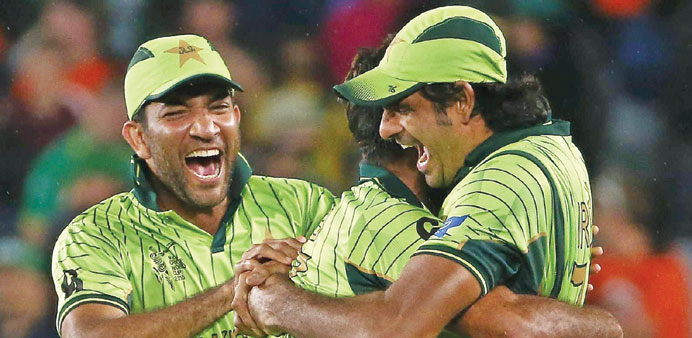 Pakistan players celebrate after their win over South Africa. (AFP)