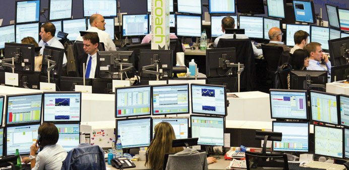 Traders work at the stock exchange in Frankfurt yesterday. The Dax index climbed 0.94% to reach 8,383.3 points in yesterdayu2019s trading.
