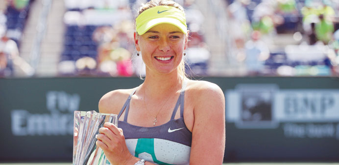 Maria Sharapova poses with the trophy