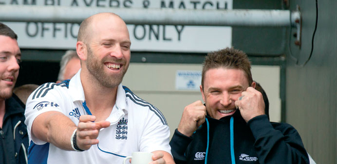 Englandu2019s Matt Prior (L) jokes with New Zealand captain Brendon McCullum as rain halts play during day five of the Test at the Basin Reserve in Wellin