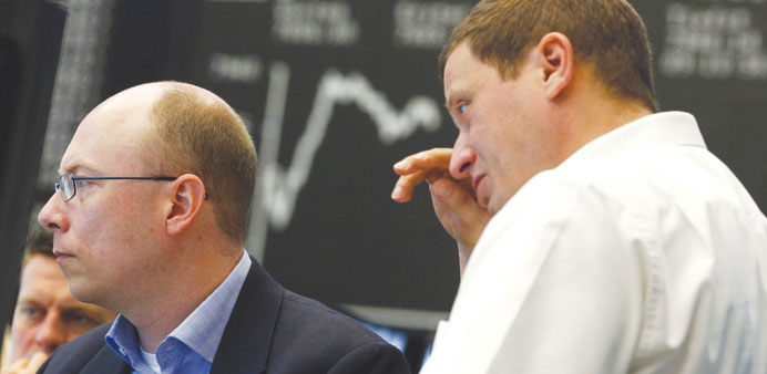 Traders work on the floor of the Frankfurt Stock Exchange yesterday. Frankfurtu2019s Dax 30 gained 2.08% to 7,968.54 points in yesterdayu2019s trading.