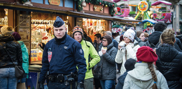  Police officers patrolling  at the Colmar Christmas market in France.